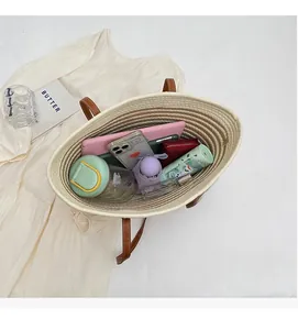 Top view of woven tote bag showing large capacity for essentials like tablet and umbrella
