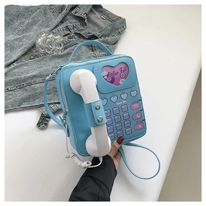 Retro light blue PU leather handbag in vintage telephone shape with a heart window