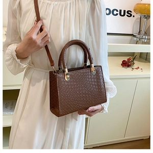 Elegant dark brown business commuter handbag with crocodile texture and gold hardware