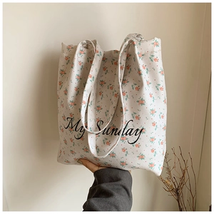 Minimalist canvas tote bag with pink floral print and My Sunday artistic text design