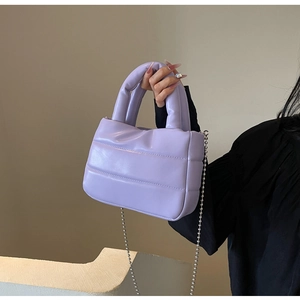 Close-up of lilac quilted PU leather tote bag featuring a silver bead chain strap