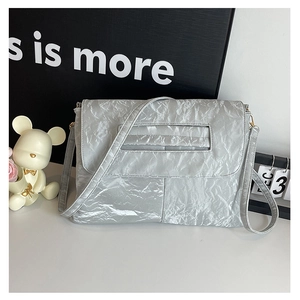Modern metallic silver crossbody bag with pleated PU texture and minimalist flap design