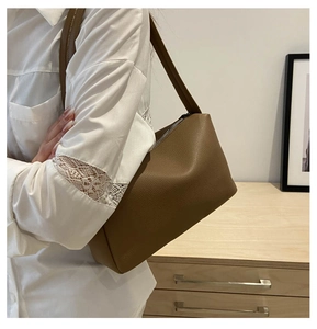 Brown lychee grain PU leather shoulder bag with silver zipper and minimalist design
