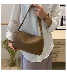 Brown litchi grain PU leather shoulder bag styled with white lace shirt and lilac skirt