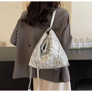 Detail of silver marble pattern PU leather crossbody bag with metal butterfly logo