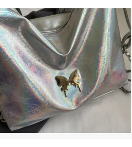 Close-up of silver laser PU texture with wrinkle finish and metal butterfly buckle