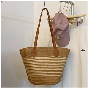 Handwoven straw tote bag with khaki striped pattern and leather shoulder straps