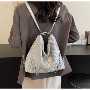 Detailed macro view of silver marble pattern PU backpack with gold butterfly buckle