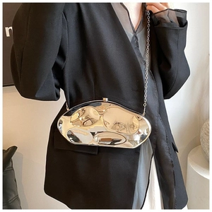 Chic silver metallic clutch bag with irregular streamlined texture and chain strap