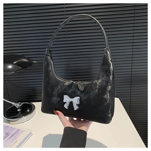 Minimalist black PU leather underarm bag with vintage silver bow and top handle strap