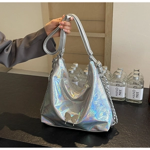 Detail shot of holographic silver PU bag with metallic butterfly clasp and side chain