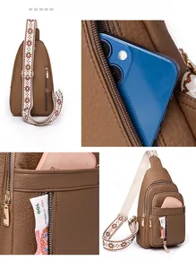Detail view of brown pebbled leather crossbody bag with multiple pockets and patterned strap