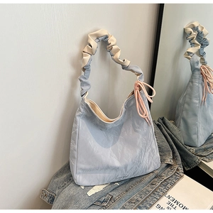 Fashionable light blue pleated tote bag with ruffle handle and pink drawstring detail