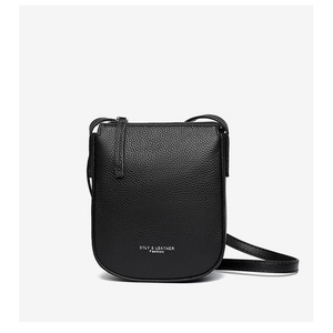Minimalist black pebble grain leather crossbody bag with silver logo and thin strap