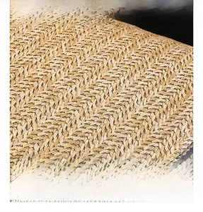 Detailed macro view showing the tight herringbone weave texture of the straw fabric bag