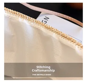 Detail view of woven straw bag stitching with high-quality interior fabric lining
