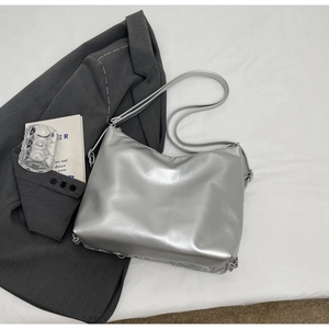 Minimalist silver metallic PU leather crescent shoulder bag with adjustable strap and hardware