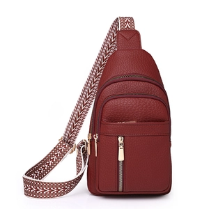 Chic burgundy lychee leather crossbody bag with ethnic patterned wide woven strap for women
