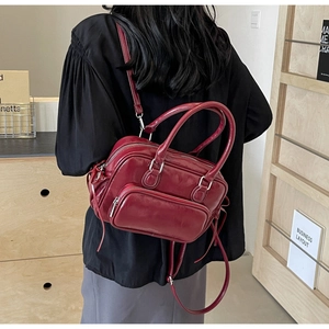 Deep red PU leather backpack for women with silver zippers and stylish long tassels