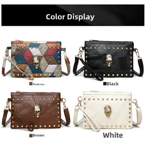 Close-up of four skull rivet clutch bags featuring crystal details and textured leather