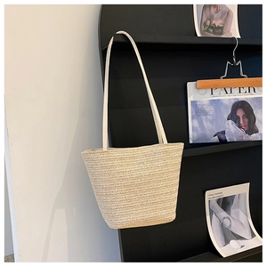 Minimalist cream woven straw shoulder bag with V-pattern texture for summer style