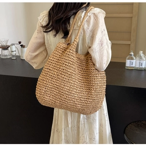 Close-up of woven paper rope tote bag with mesh texture and handmade craftsmanship detail