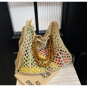 Handmade woven tote bag with dark brown wooden bead handles and summer vacation style