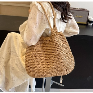 Close-up of woven straw tote bag texture in a cozy indoor leisure lifestyle setting