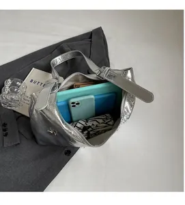 Top view of silver metallic PU tote bag showing large capacity for tablet and phone