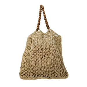 Straw woven hollow mesh tote bag with dark wood bead handles and interior lining