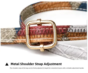 Close-up of adjustable multicolored leather shoulder strap with gold metal buckle
