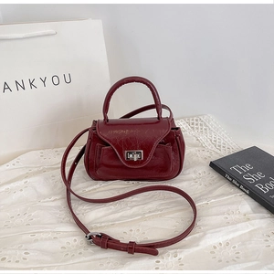 Deep wine red patent PU leather handbag with silver twist lock and crossbody strap