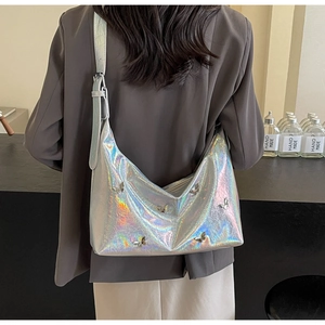 Detailed back view of large holographic shoulder bag with metallic butterfly accents