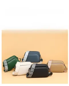 Litchi texture leather crossbody bags with geometric pattern straps in multiple colors