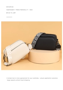 Detail view of lychee pattern leather crossbody bags with colorful geometric shoulder straps
