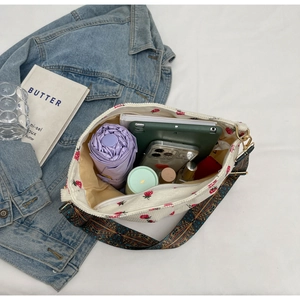 Top view of corduroy tote bag showing large capacity with tablet and umbrella inside