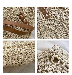 Macro view of woven straw bag featuring brown leather straps and detailed stitching