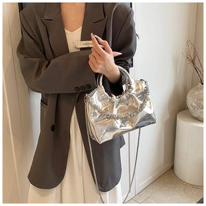 Detail of silver metallic PU crossbody bag with pleated design and fine chain strap