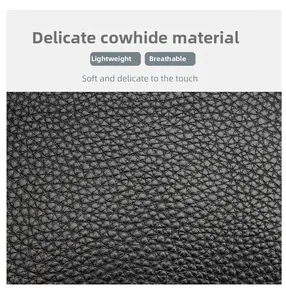 Detailed macro view showing the soft lychee grain texture of high-quality black cowhide leather