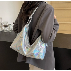 Chic silver holographic PU crossbody bag with 3D metal butterflies on a model