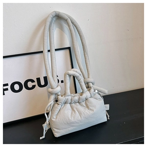 Minimalist light grey pleated cloud bag with drawstring and chunky knotted strap