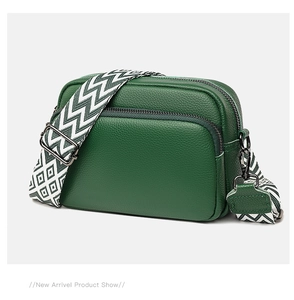 Detail of green litchi texture leather small square bag with woven crossbody strap