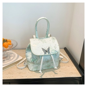 Minimalist light green PU leather backpack featuring delicate butterfly pattern and metal clasp