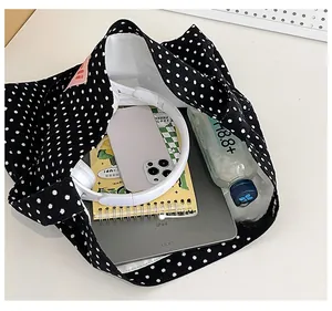 Top view of large capacity black polka dot canvas tote bag showing spacious interior storage