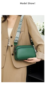 Detail of green lychee leather crossbody bag with geometric pattern wide strap