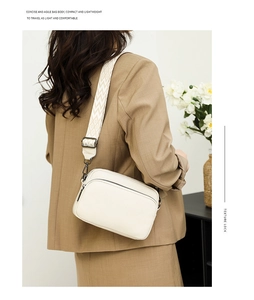 Detail of lychee pattern leather bag with geometric jacquard wide shoulder strap