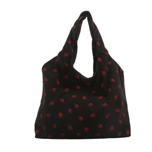 Black corduroy tote bag with red strawberry embroidery in a minimalist Korean style
