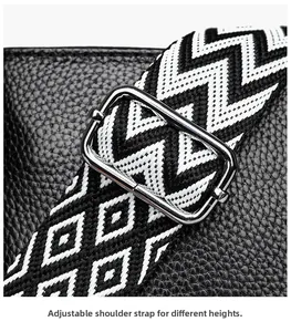 Close-up of adjustable geometric shoulder strap with silver buckle on black leather bag