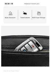 Close-up of black lychee grain leather bag with smooth metal zipper and multi-layer storage