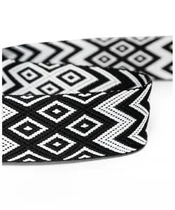 Close-up of a wide woven shoulder strap with black and white geometric ethnic patterns
